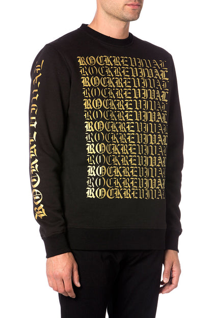 Schwarzer Pullover mit goldfarbenem "Rock Over Everything" Schriftzug auf Vorderseite und Ärmel.