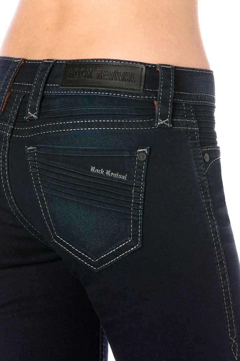 Dunkelblaue Skinny-Jeans für Damen mit markantem Rückenlabel und kontrastierenden Nähten.